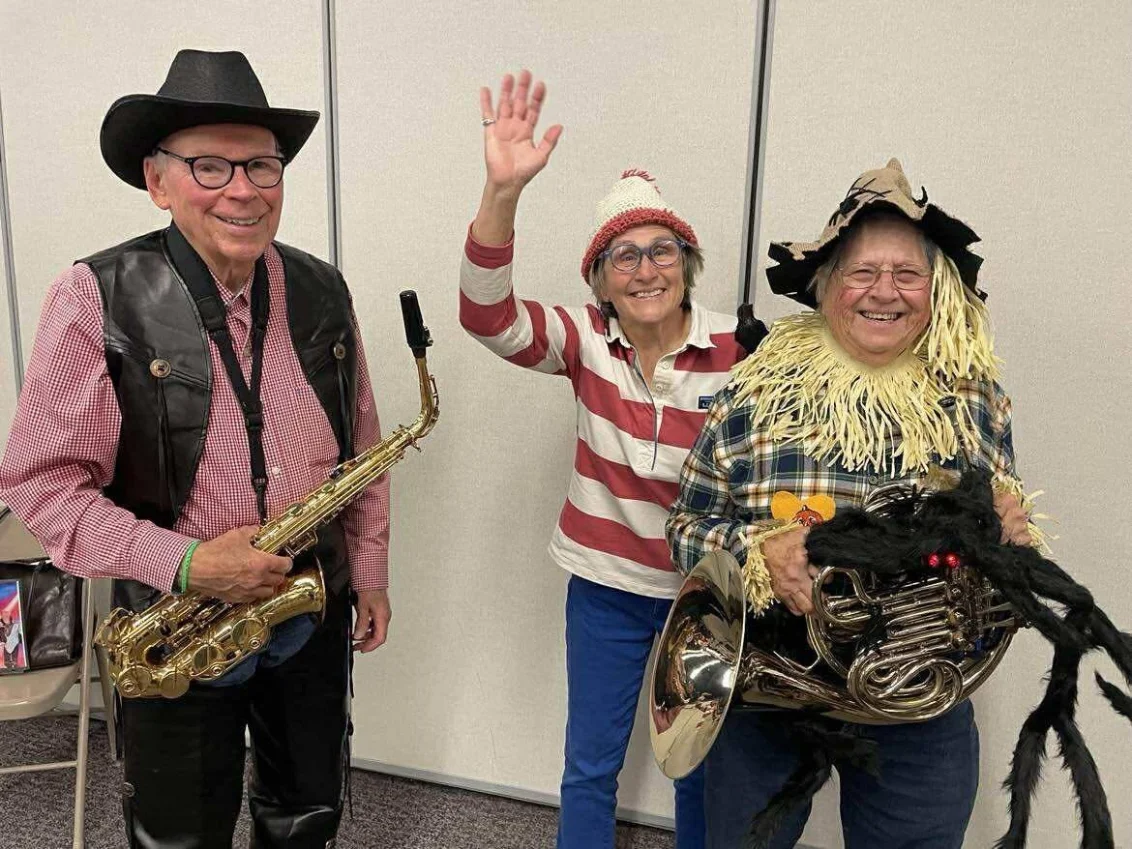 Band members wearing Halloween costumes at rehearsal